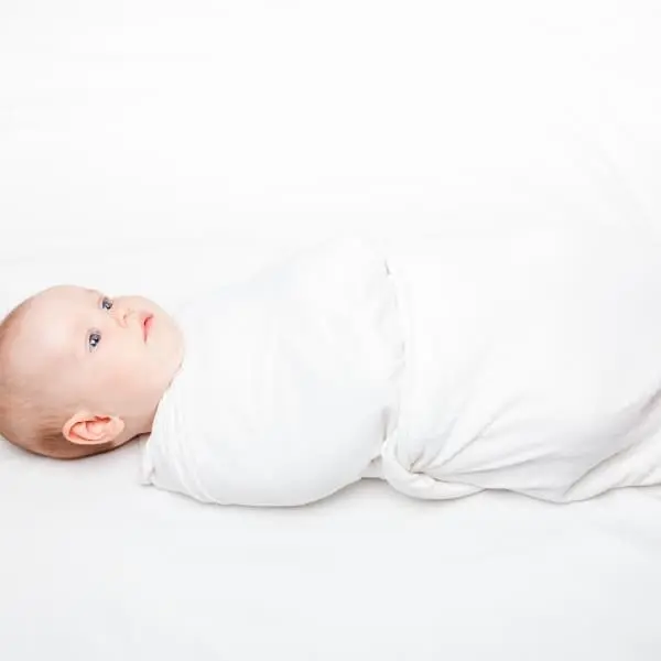 baby in swaddle blanket